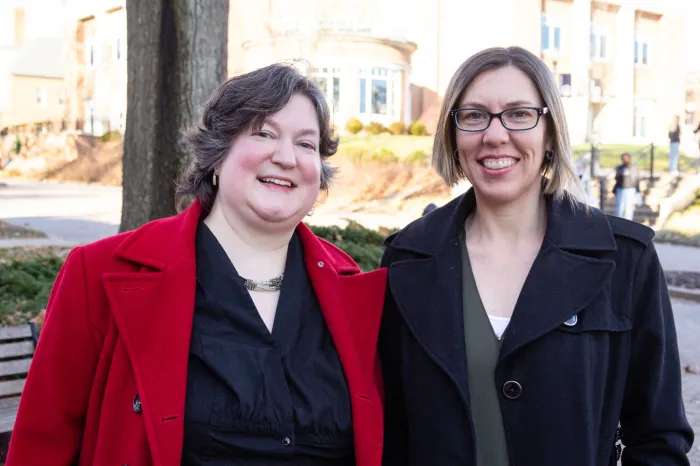 McCoy Professors Lynn Bostrom and Nicole Livengood outside of Andrews Hall