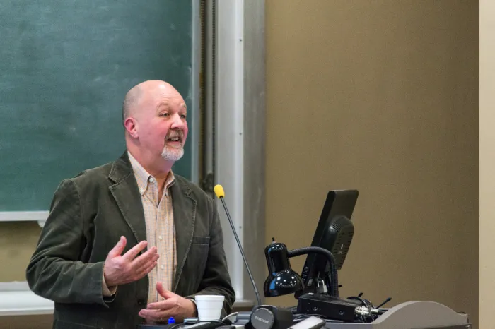 Mark Sibicky lecturing at a podium