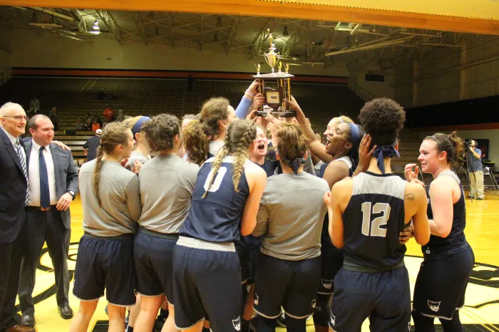 Holding the OAC trophy