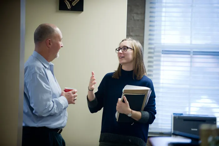 Professor Mark Sibicky speaking with a student