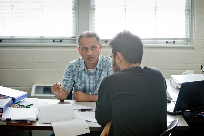 Professor helping a student in his office