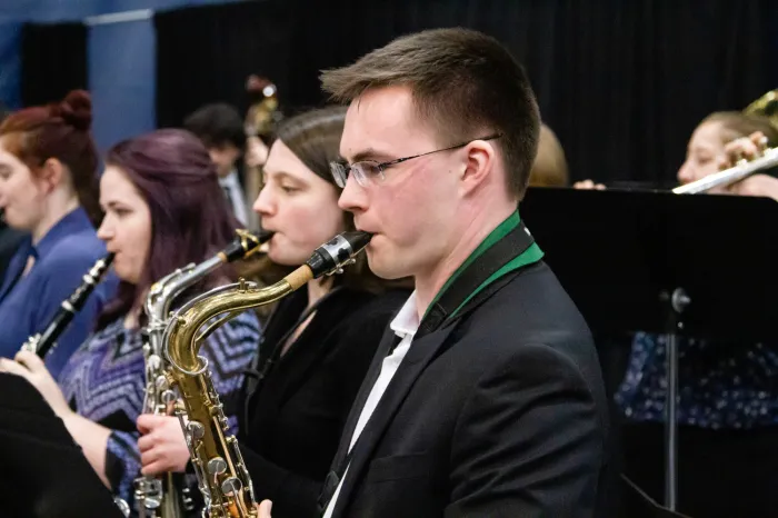 Male student playing the saxophone