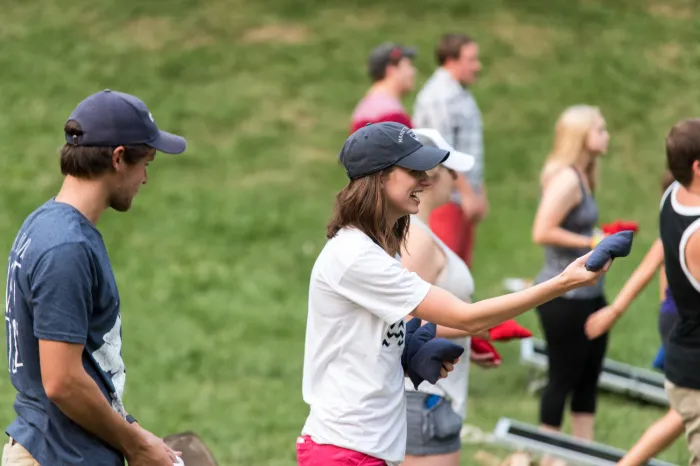 Students playing corn hole