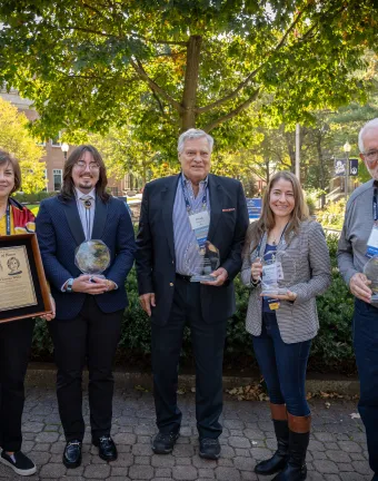 Five  MCAA Award Winners standing with awards outdoors
