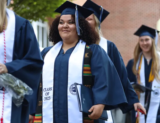 Female student smiling at graduation