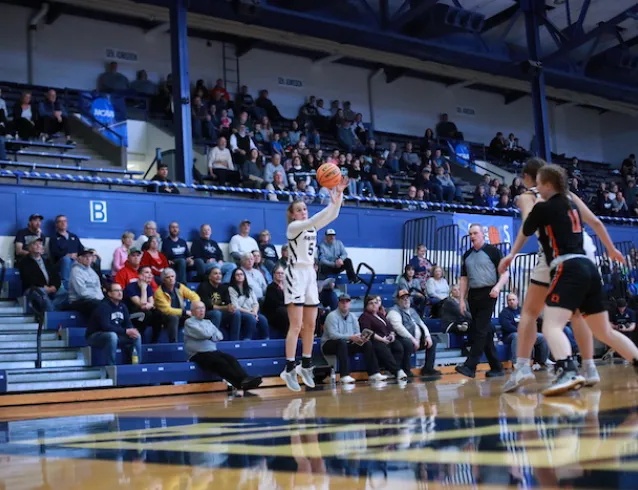 Hannah Schill attempts a three-point shot