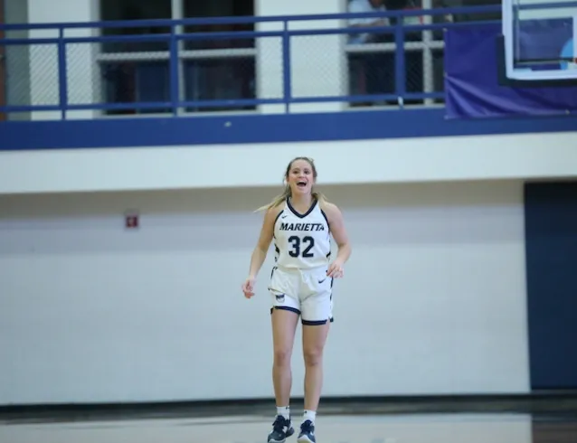 A Marietta College women's basketball player smiles during a game on Fenton Court at Ban Johnson Arena