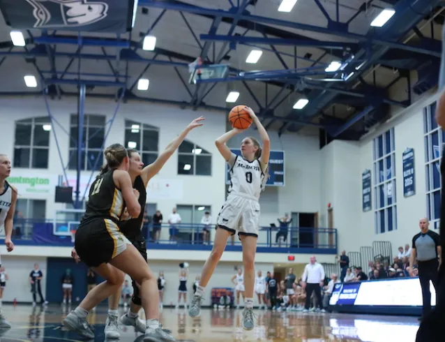 A Marietta College women's basketball player attempts a shot during a game at Fenton Court at Ban Johnson Arena