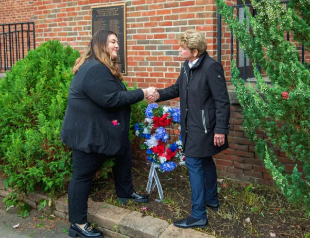 Maria Cipro and President Drugovich shake hands