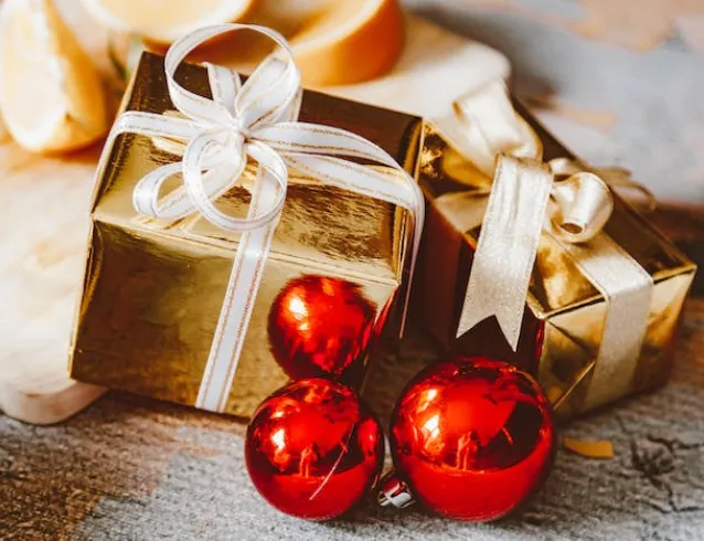 Christmas presents wrapped in gold