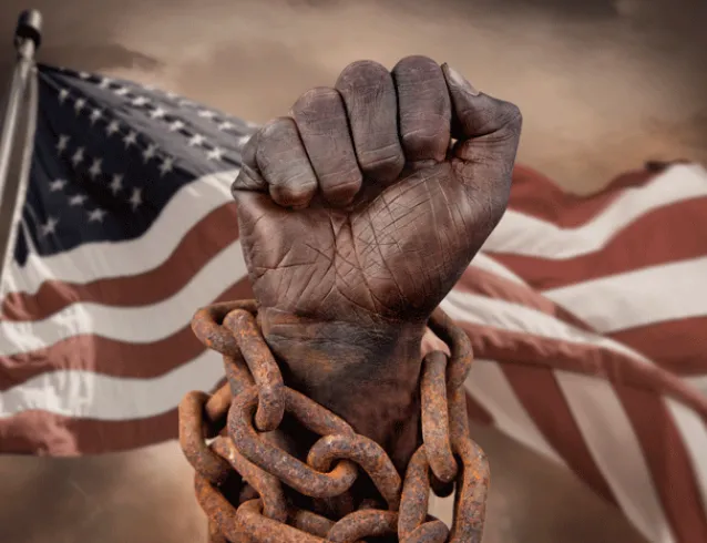 Black hand in chains with an American Flag