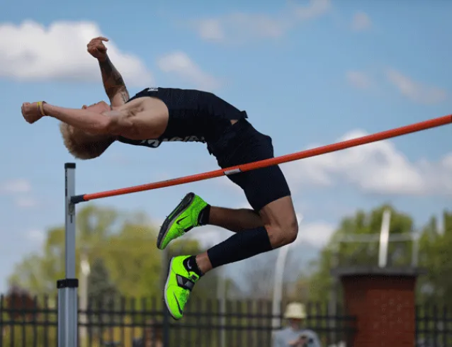 Athlete clearing the high jump bar