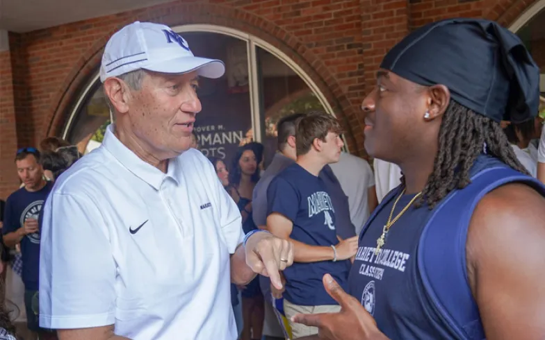 Joe Chlapaty chats with a student.