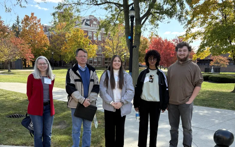 Dr. Kuhl, Dr. Bragg, and physics students attend the APS Conference