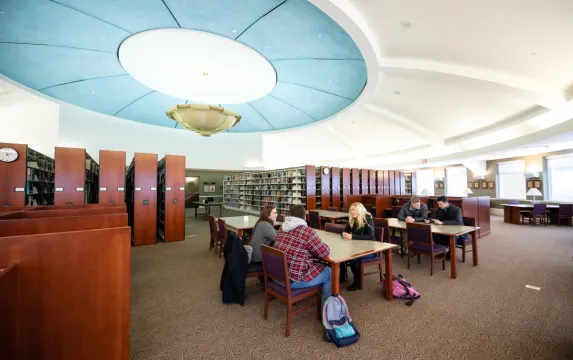 Students studying in Legacy Library