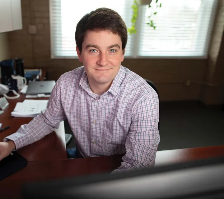 Portrait of Doan Charles at his desk