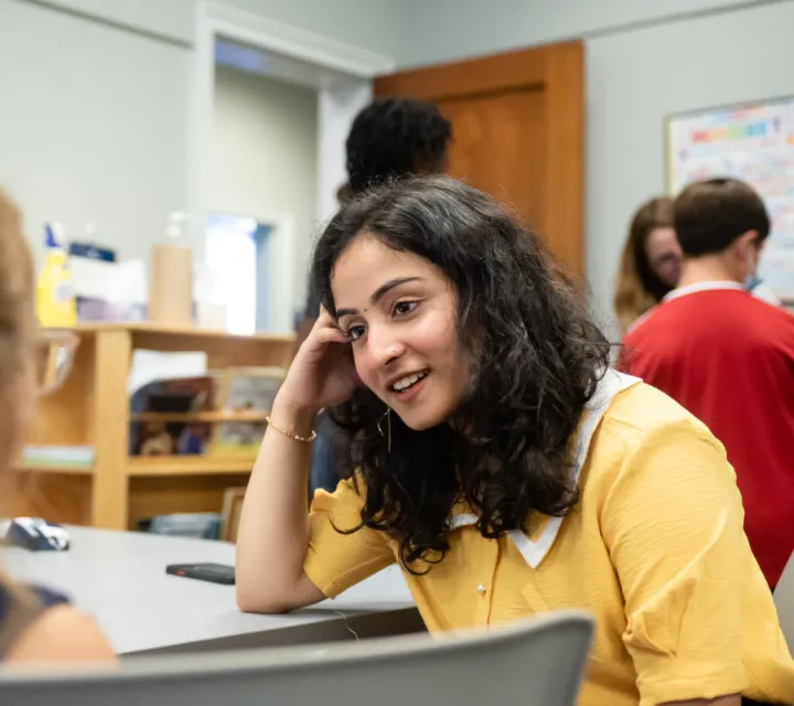 A Marietta College Education student talks with a child