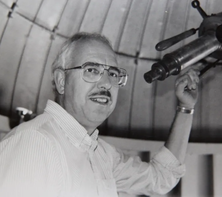 Dr. John Michel at a telescope