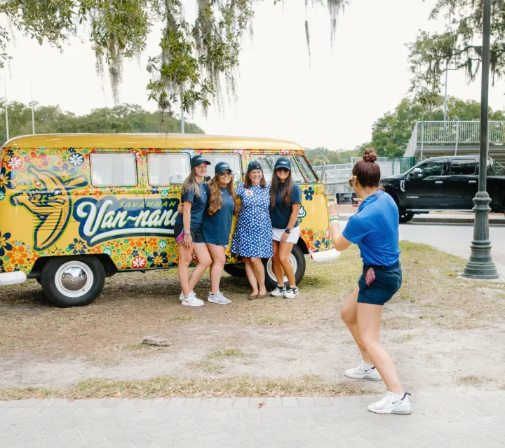 Marietta College Sport Management students pose in front of the Savannah Bananas bus