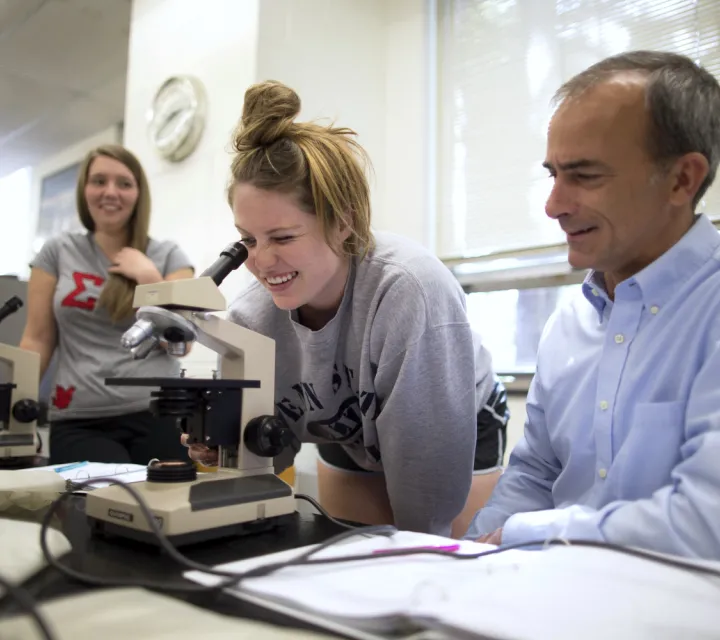 A health science major at Marietta College uses a microscope during a lab