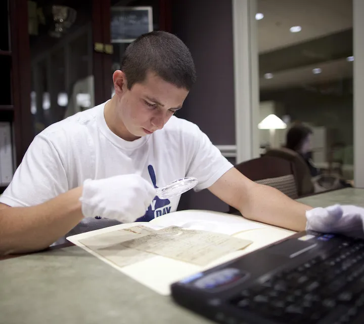 A Marietta College student majoring in history works on a project in the Legacy Library