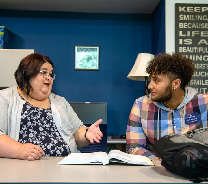 Marietta College Academic Resource Center Director Amanda Haney-Cech works with a student