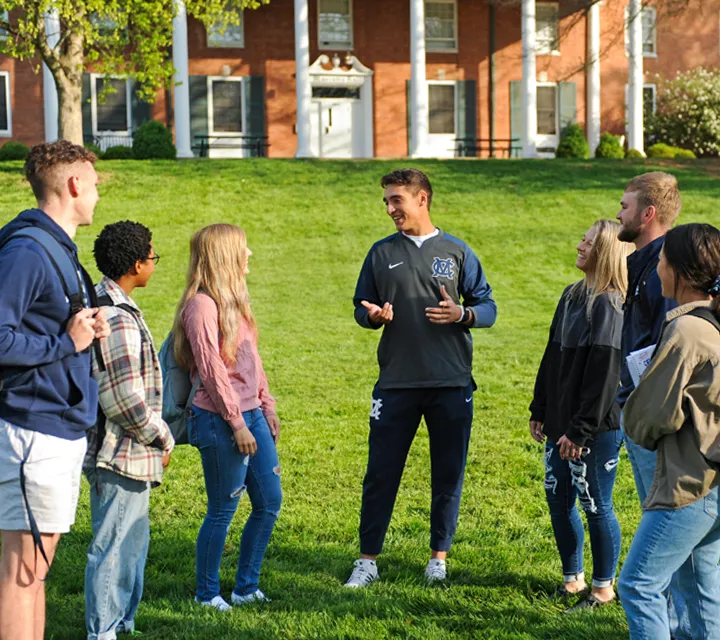 Marietta College Students talk outside of Marietta Hall