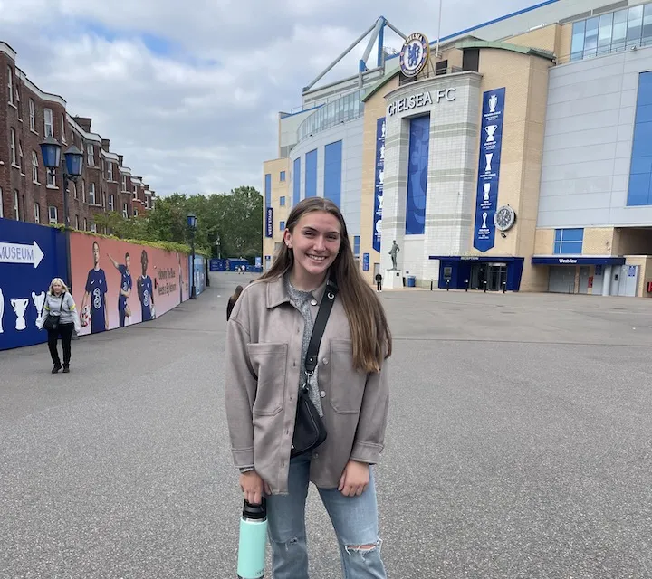 Marietta College student Kaylie Ward ’24 poses for a photo at Stamford Bridge during her Education Abroad trip to London
