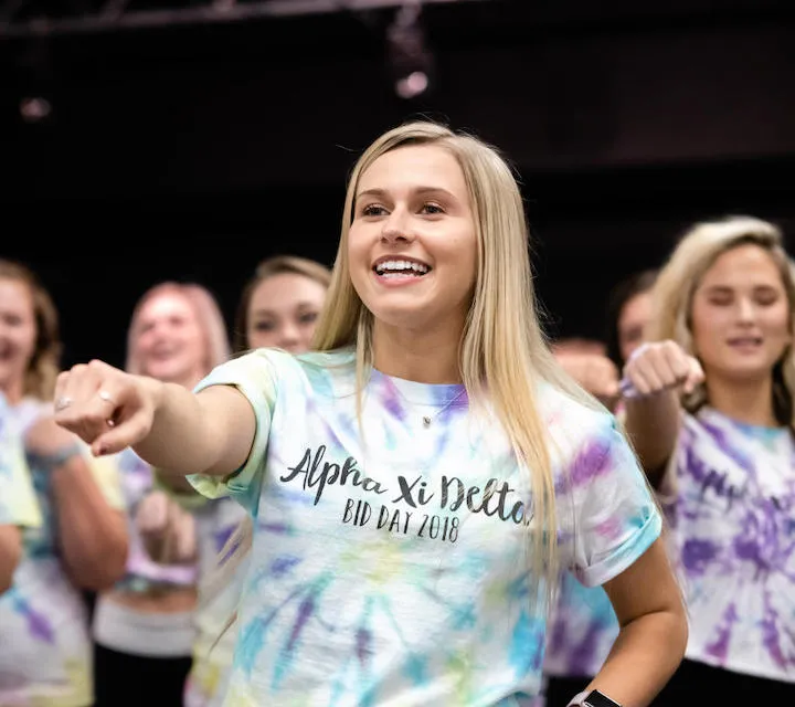 A Marietta College Alpha Xi Delta Member participates in a pep rally