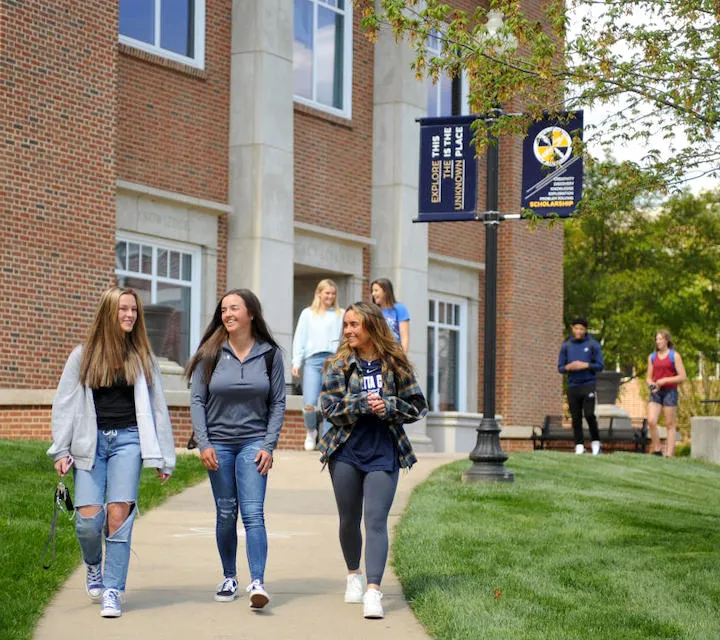 Two Marietta College students walking outside Legacy Library