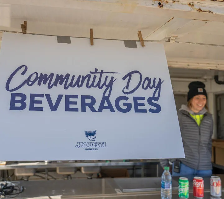 A Marietta College Sport Management student works during Baseball Community Day