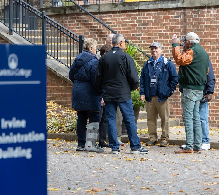 Marietta College Alumni chat outside Legacy Library during Homecoming 2023