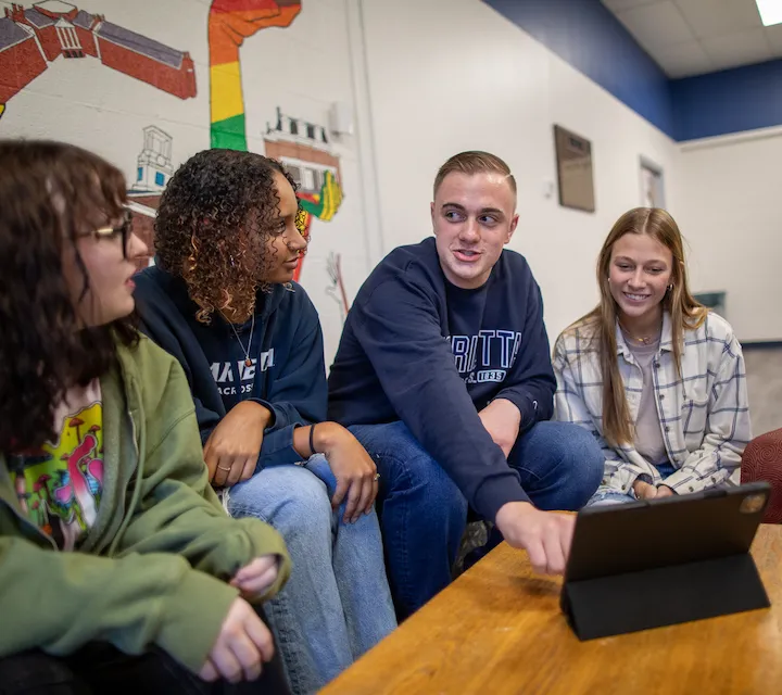 Marietta College students sitting around a table