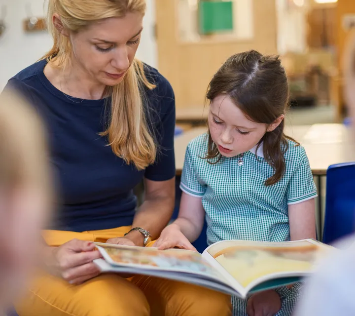 Teacher and student reading