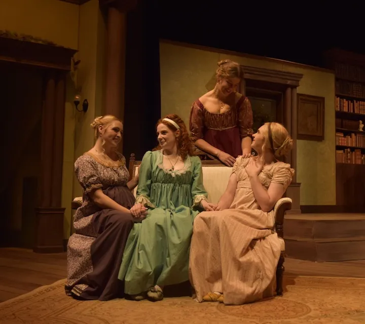 four theatre students acting on stage