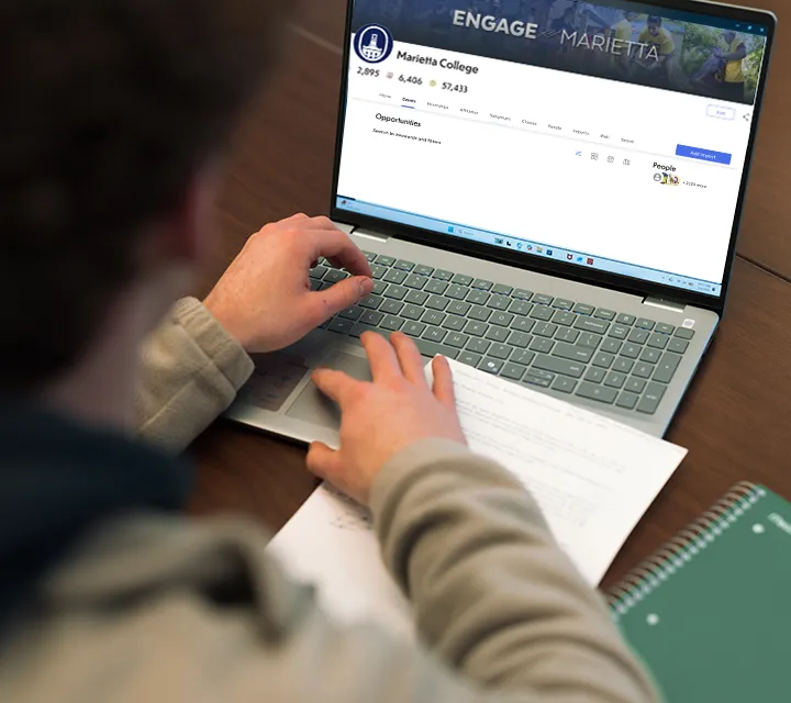 Student working on computer open to Engage Marietta