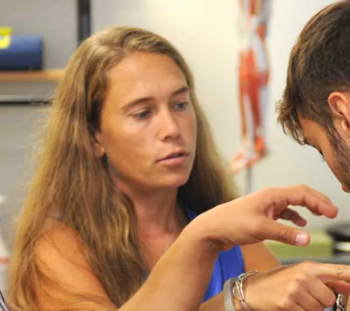 students with professor in athletic training