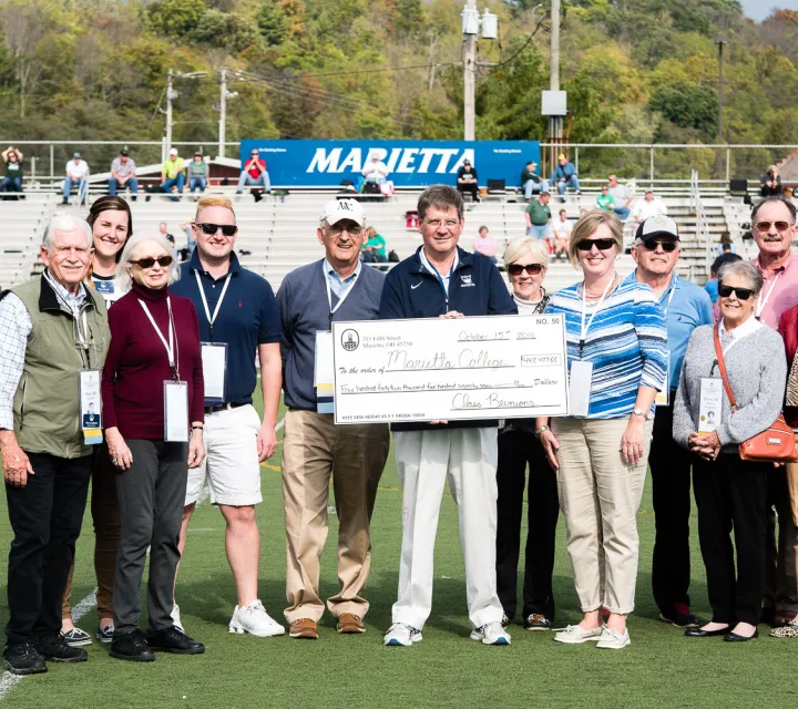 Class of 1966 check presentation at Homecomin