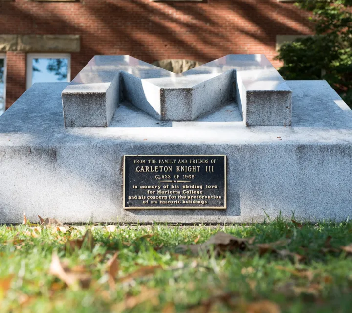 Concrete 'M' memorial outside of Andrews Hall