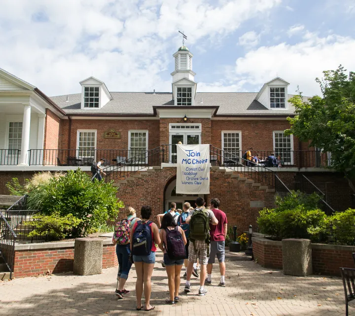 A group of students waiting to enter Gilman on the first day of class