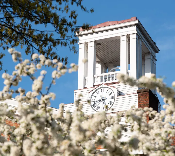Erwin Tower at Marietta College framed by white flowers