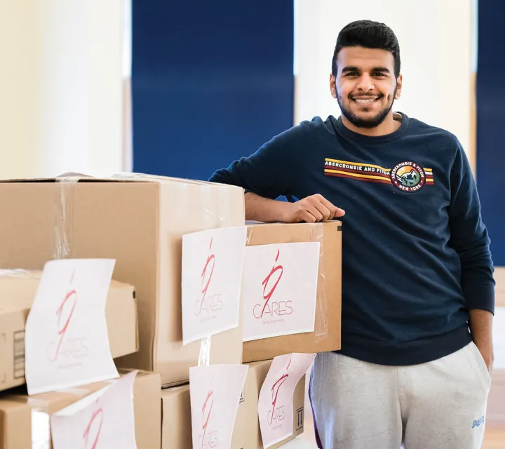 Omar AlMjmad a Marietta College student membe of Alwihda who headed it's annual clothing drive