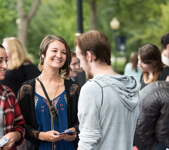 Students talk in a crowd