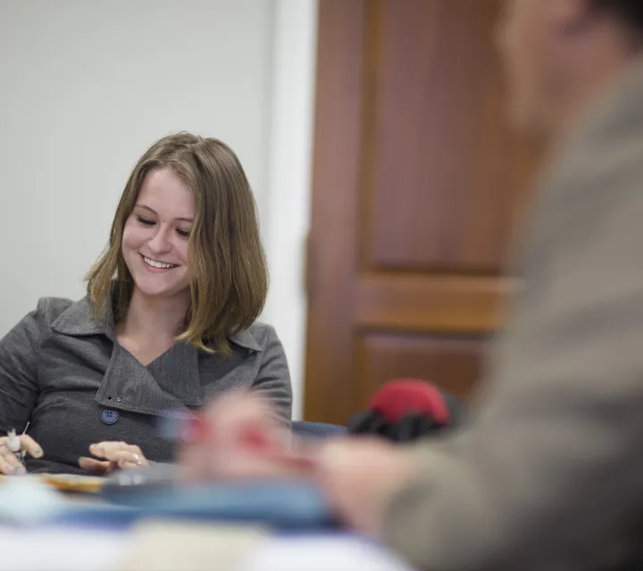 Student smiles in classroom