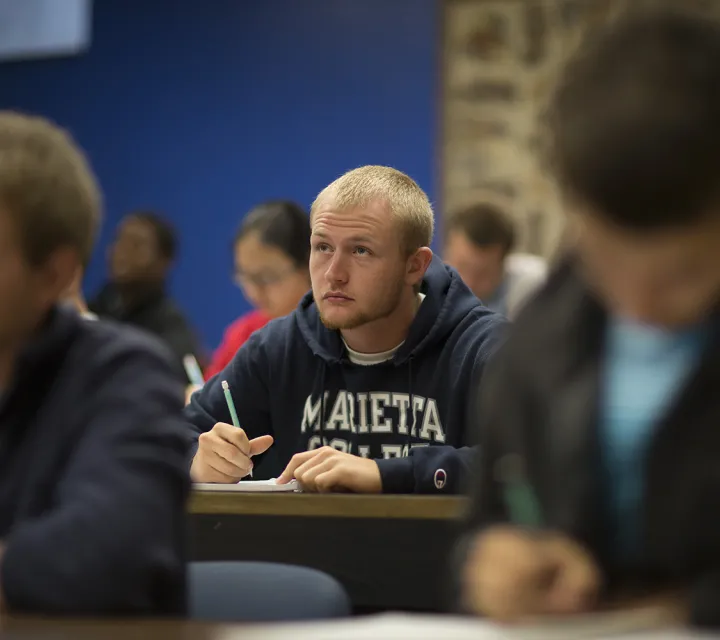 student looks up in class