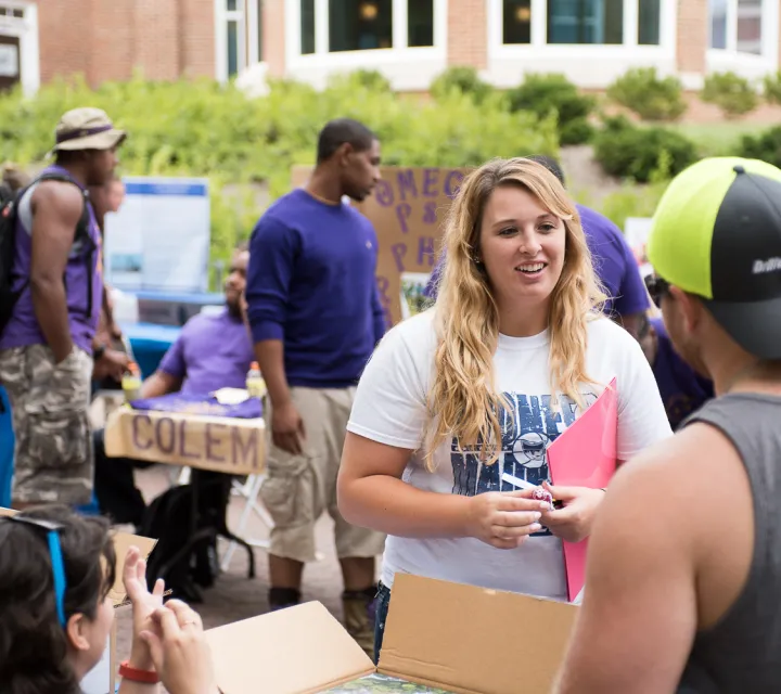 Student talks to a student organization at the Involvement Fair