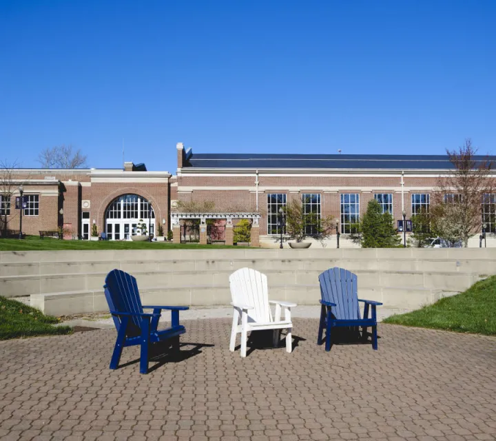 Three Marietta College chairs sitting in the amphitheater