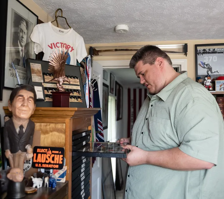 MC Alumni Matt Dole surrounded by his collection of political memorabilia