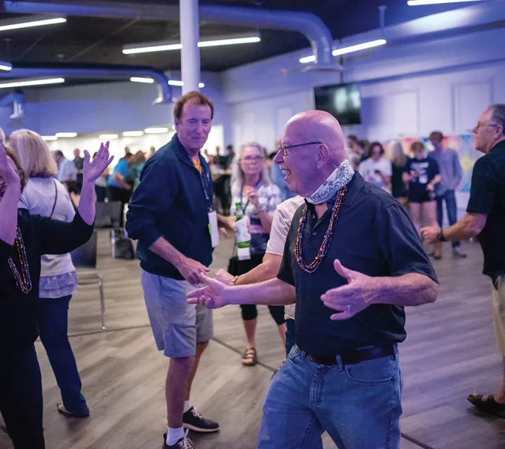 Alumni — including John Wendell ’69 (center), Margie Toth Kraft ’69 (left) and her husband James (right) dance the night away reliving hits from Woodstock ’69.
