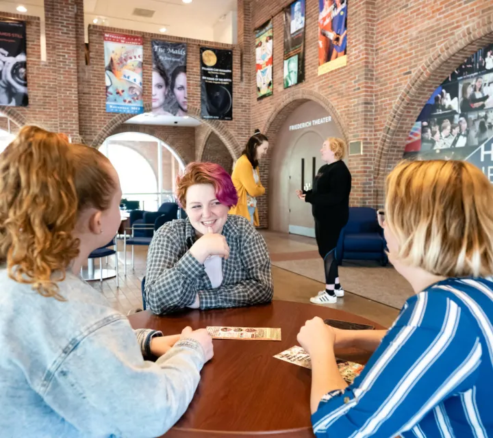 Students hang out in Hermann Fine Arts Center lobby